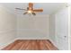 Bright bedroom with ceiling fan and hardwood floors at 3703 Green Sea Rd., Green Sea, SC 29545