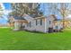 Beige house with a large green lawn and a porch at 3703 Green Sea Rd., Green Sea, SC 29545