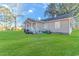 Tan house with white trim, deck, and spacious yard at 3703 Green Sea Rd., Green Sea, SC 29545