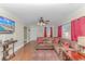 Bright living room with hardwood floors and sectional couch at 3703 Green Sea Rd., Green Sea, SC 29545