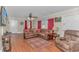 Living room with hardwood floors, leather furniture, and ample natural light at 3703 Green Sea Rd., Green Sea, SC 29545