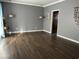 Spacious living room with wood-look floors and neutral walls at 402 S S. Firestation Rd., Johnsonville, SC 29555