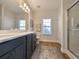 Modern bathroom with dark vanity, quartz countertop, and a walk-in shower at 410 Rosemary St., Georgetown, SC 29440