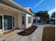 Inviting front entrance with a teal door and landscaping at 410 Rosemary St., Georgetown, SC 29440