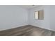 Simple bedroom with laminate wood floors and a window at 4278 Pinehurst Circle # W8, Little River, SC 29566