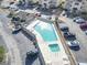 Aerial view of a community pool with surrounding lounge chairs at 4278 Pinehurst Circle # W8, Little River, SC 29566