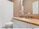 Clean bathroom with granite countertop and white cabinets at 4440 Turtle Ln. # 1C, Little River, SC 29566