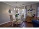 Smaller dining area with glass table and seating for four at 4648 Lightkeepers Way # 39-A, Little River, SC 29566