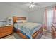 Cozy bedroom with a full-size bed and window curtains at 4850 Meadowsweet Dr. # 1711, Myrtle Beach, SC 29579