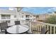 Private balcony with table and chairs, offering a community view at 4872 Dahila Ct. # 301, Myrtle Beach, SC 29577