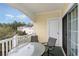 Private balcony with table and chairs and wooded area view at 4872 Dahila Ct. # 301, Myrtle Beach, SC 29577