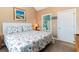 Main bedroom with king-size bed and en-suite bathroom access at 4872 Dahila Ct. # 301, Myrtle Beach, SC 29577