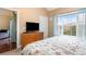 Bedroom with king bed, dresser, TV, and access to a second room at 4872 Dahila Ct. # 301, Myrtle Beach, SC 29577
