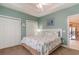 Bedroom with queen bed, closet, and view into another room at 4872 Dahila Ct. # 301, Myrtle Beach, SC 29577
