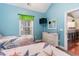 Bedroom with twin beds, dresser, and kitchen view at 4872 Dahila Ct. # 301, Myrtle Beach, SC 29577
