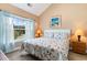 Spacious bedroom with king-size bed, large window, and wood dresser at 4872 Dahila Ct. # 301, Myrtle Beach, SC 29577