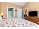 King bedroom with en-suite bathroom and adjacent sitting area at 4872 Dahila Ct. # 301, Myrtle Beach, SC 29577
