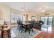 Dining room with hardwood floors and a chandelier, open to the living room at 4872 Dahila Ct. # 301, Myrtle Beach, SC 29577