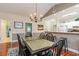 Dining area with table and chairs, open to living room and kitchen at 4872 Dahila Ct. # 301, Myrtle Beach, SC 29577