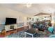 Open concept living room with hardwood floors, and access to kitchen and dining at 4872 Dahila Ct. # 301, Myrtle Beach, SC 29577