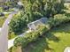 Aerial view showing a house nestled among trees and a paved driveway at 505 Alston St., Conway, SC 29526