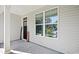 Covered front porch with black front door at 505 Alston St., Conway, SC 29526