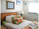 Bedroom with tropical bedding and a TV at 5905 S Kings Highway # 2106-C, Myrtle Beach, SC 29575