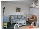 Living room features sofa, chairs, and coffee table at 5905 S Kings Highway # 2106-C, Myrtle Beach, SC 29575