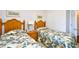 Guest bedroom with twin beds and adjacent closet at 6203 Catalina Dr. # 1814, North Myrtle Beach, SC 29582