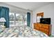 King bedroom with large window, dresser, and TV at 6203 Catalina Dr. # 1814, North Myrtle Beach, SC 29582