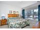 Main bedroom with king-size bed and large window with nature views at 6203 Catalina Dr. # 1814, North Myrtle Beach, SC 29582