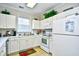 Clean and functional kitchen with white cabinets and appliances at 6203 Catalina Dr. # 1814, North Myrtle Beach, SC 29582