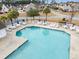 Community pool with ample deck space, chairs, and tables for lounging at 629 Riverward Dr. # 629, Myrtle Beach, SC 29588