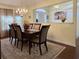 Formal dining room with hardwood floors, chandelier, and china cabinet at 635 Bucks Trail, Longs, SC 29568