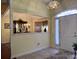 Bright entryway with tiled floors and view into dining area at 635 Bucks Trail, Longs, SC 29568