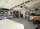 Large garage with overhead storage and work area at 635 Bucks Trail, Longs, SC 29568