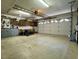 Garage with workbenches, cabinets, and lots of storage at 635 Bucks Trail, Longs, SC 29568