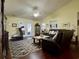 Spacious living room with hardwood floors, leather couches, and a coffee table at 635 Bucks Trail, Longs, SC 29568