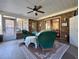 Relaxing screened porch with wicker furniture and ceiling fan at 635 Bucks Trail, Longs, SC 29568