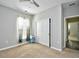 Bright bedroom with carpet, window, and double door closet at 6425 Cascata Dr., Myrtle Beach, SC 29572