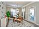 Bright dining room with glass table and four chairs at 6425 Cascata Dr., Myrtle Beach, SC 29572