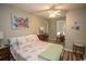 Bedroom with floral bedding, ceiling fan, and dresser at 654 Blue Bird Ln., Murrells Inlet, SC 29576