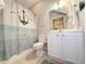 Clean bathroom with nautical-themed shower curtain and white vanity at 663 Pinehurst Dr. # 93C, Pawleys Island, SC 29585