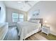 Main bedroom with king bed, ceiling fan, and plenty of natural light at 663 Pinehurst Dr. # 93C, Pawleys Island, SC 29585