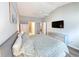 Main bedroom with king bed, large TV, and ensuite bathroom access at 663 Pinehurst Dr. # 93C, Pawleys Island, SC 29585