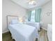 Guest bedroom with twin beds and coastal decor at 663 Pinehurst Dr. # 93C, Pawleys Island, SC 29585