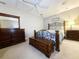 Spacious bedroom with a large bed and dark wood furniture at 663 Pinehurst Dr. # 93C, Pawleys Island, SC 29585