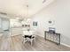 Bright dining room with white table and four chairs at 663 Pinehurst Dr. # 93C, Pawleys Island, SC 29585