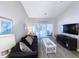 Living room with access to a screened porch at 663 Pinehurst Dr. # 93C, Pawleys Island, SC 29585
