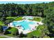 Community pool with multiple areas for swimming and relaxing at 663 Pinehurst Dr. # 93C, Pawleys Island, SC 29585